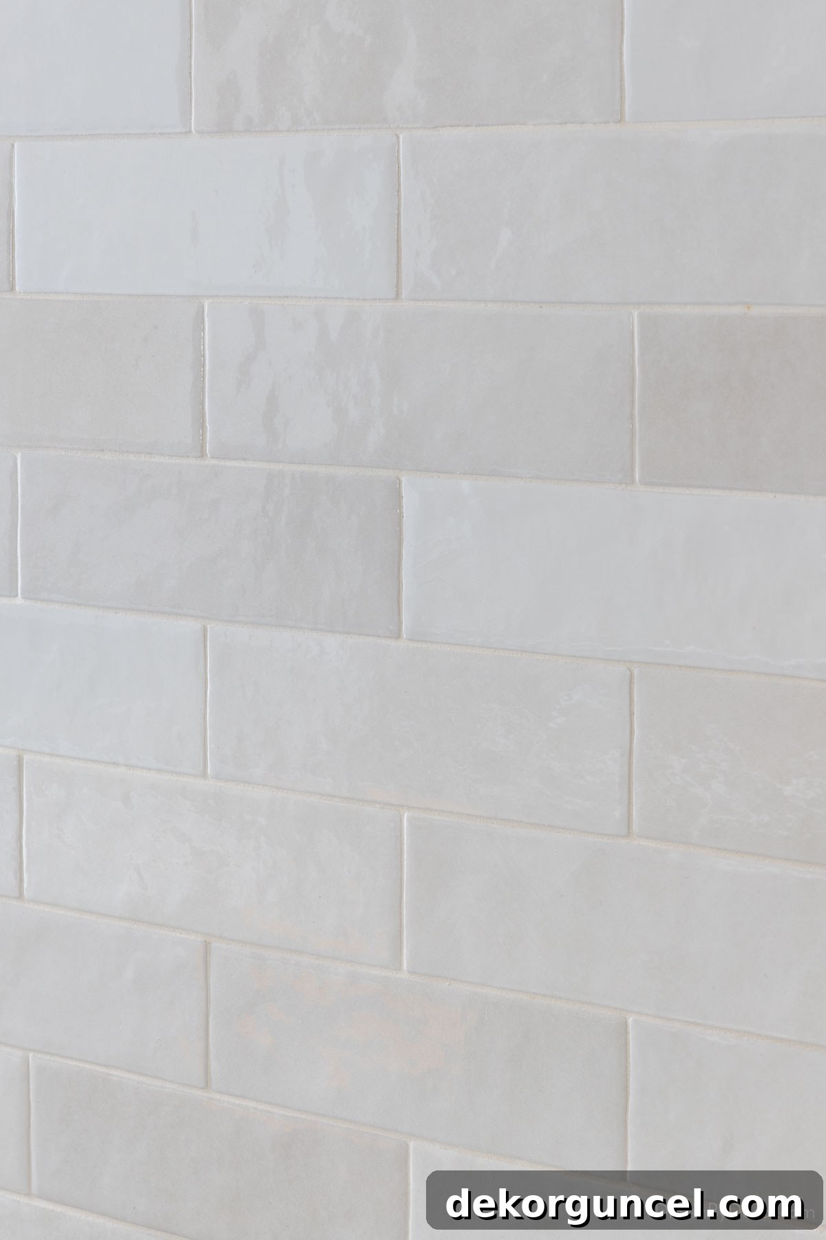 Elegant polished subway tile extending to the ceiling in a modern kitchen backsplash