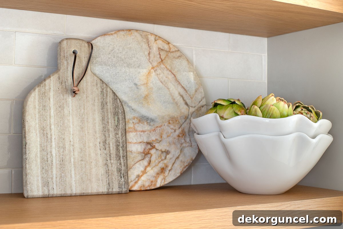 Our Kitchen's Cozy Coffee Corner 17 Marble cutting boards and scalloped bowls artfully displayed on kitchen coffee bar shelves