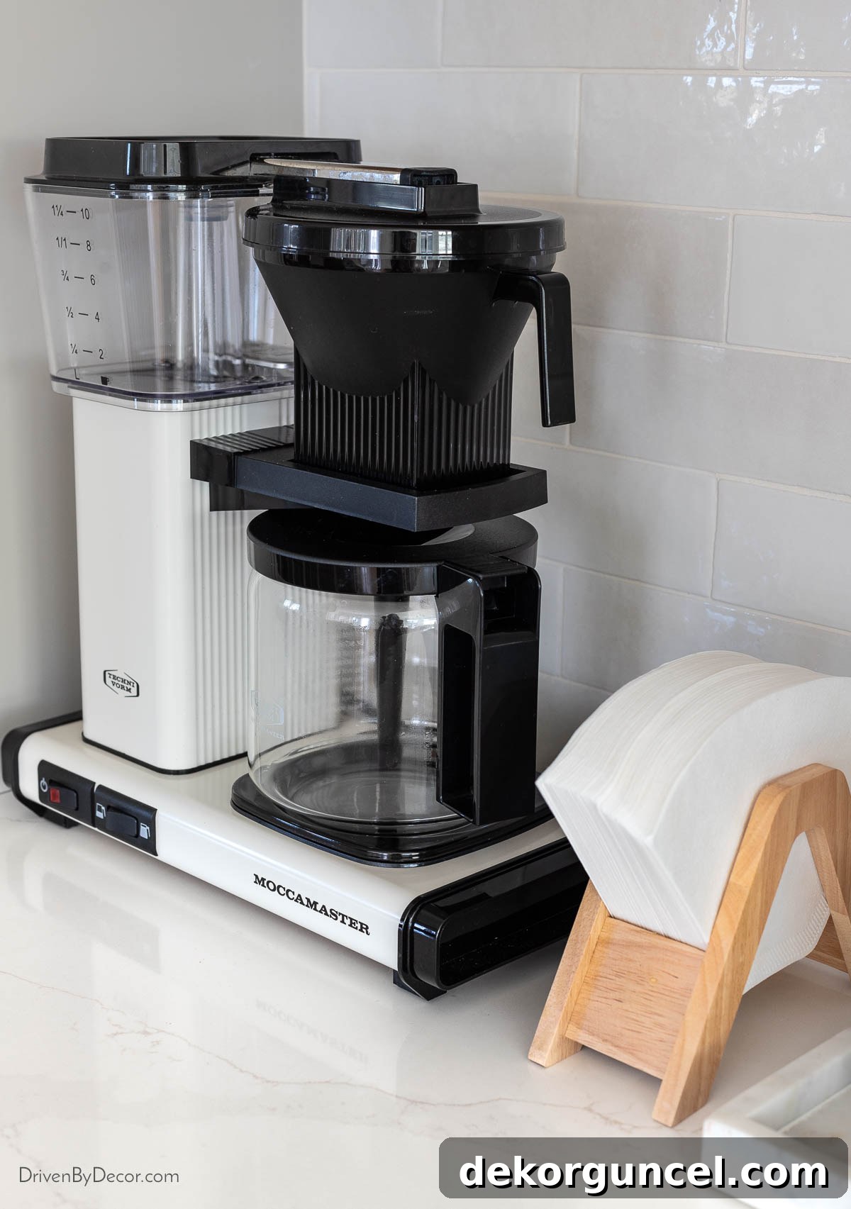 Our Kitchen's Cozy Coffee Corner 18 Coffee maker with filters neatly organized in a holder on our coffee bar
