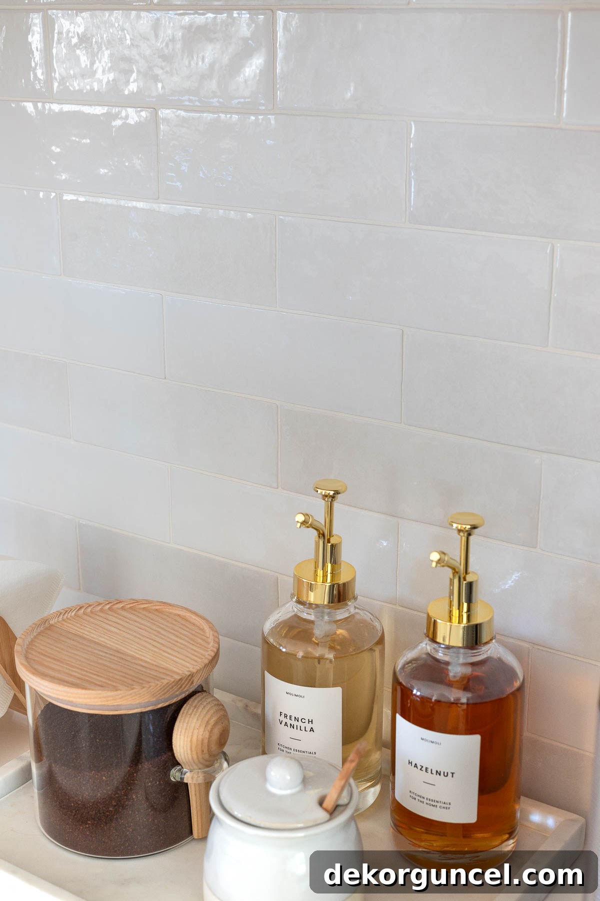 Our Kitchen's Cozy Coffee Corner 21 Glossy subway tile in various shades of gray, forming the stylish backsplash of the coffee bar