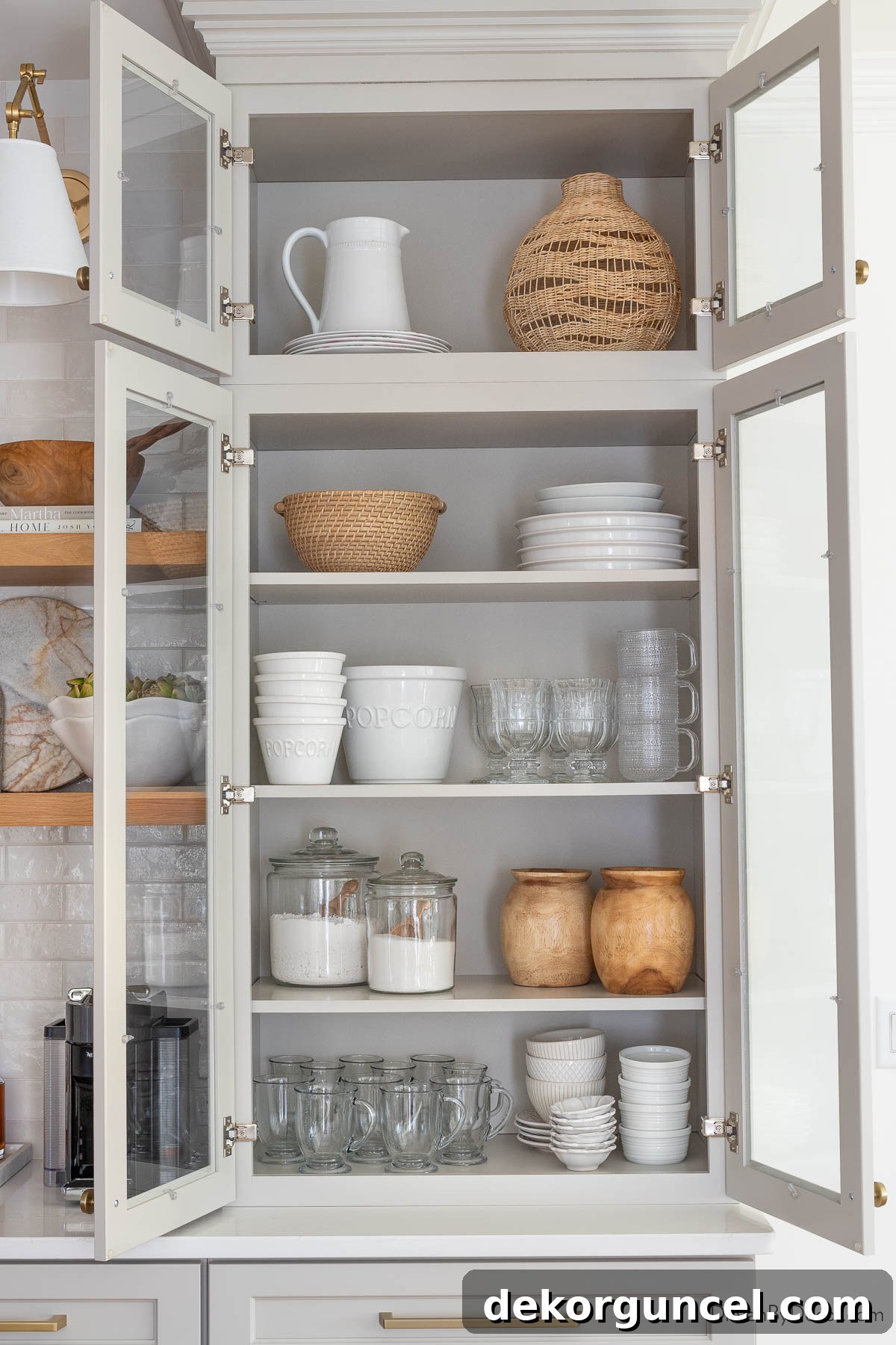 Our Kitchen's Cozy Coffee Corner 10 Storing various dinnerware and serving pieces elegantly in our glass upper cabinets
