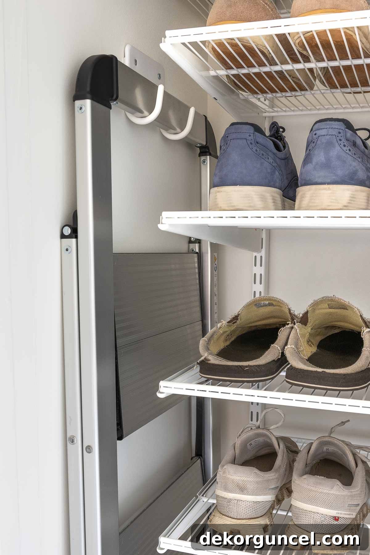 Declutter Your Home From Laundry Room Closet to Versatile Door Storage 11 Step stool hanging on wall hooks in laundry room closet