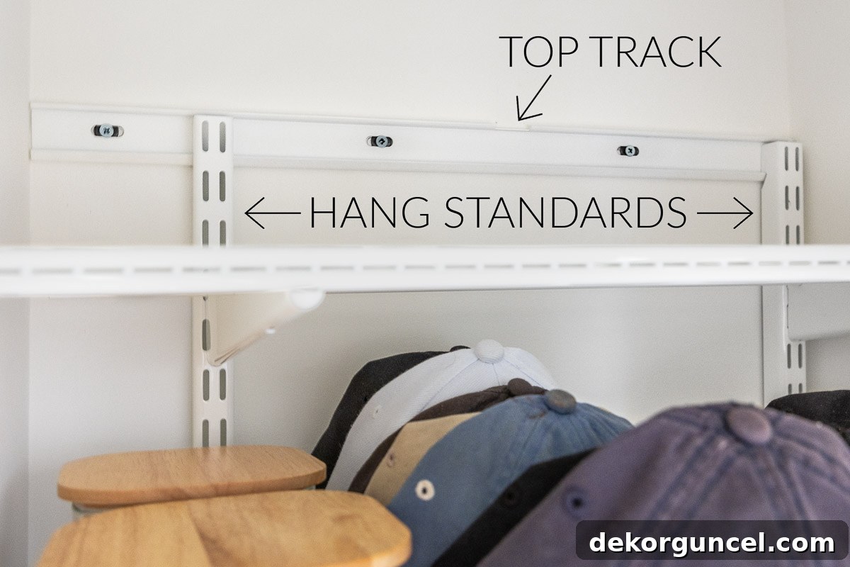 Declutter Your Home From Laundry Room Closet to Versatile Door Storage 4 Elfa system top track and hang standards for closet organization