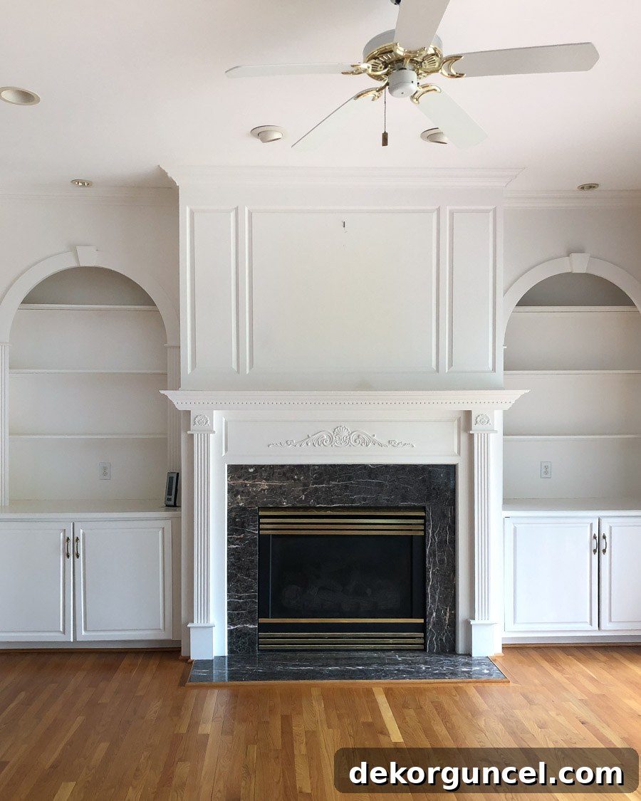 Spray Paint Your Brass Fireplace for an Instant Update 2 Our family room before we moved in, featuring a dated brass fireplace and 90s decor.