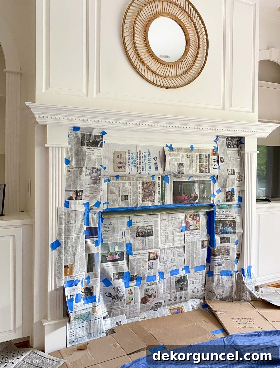 Spray Paint Your Brass Fireplace for an Instant Update 11 Preparing our fireplace for spray painting the fixed brass strip by masking surrounding areas with newspaper.