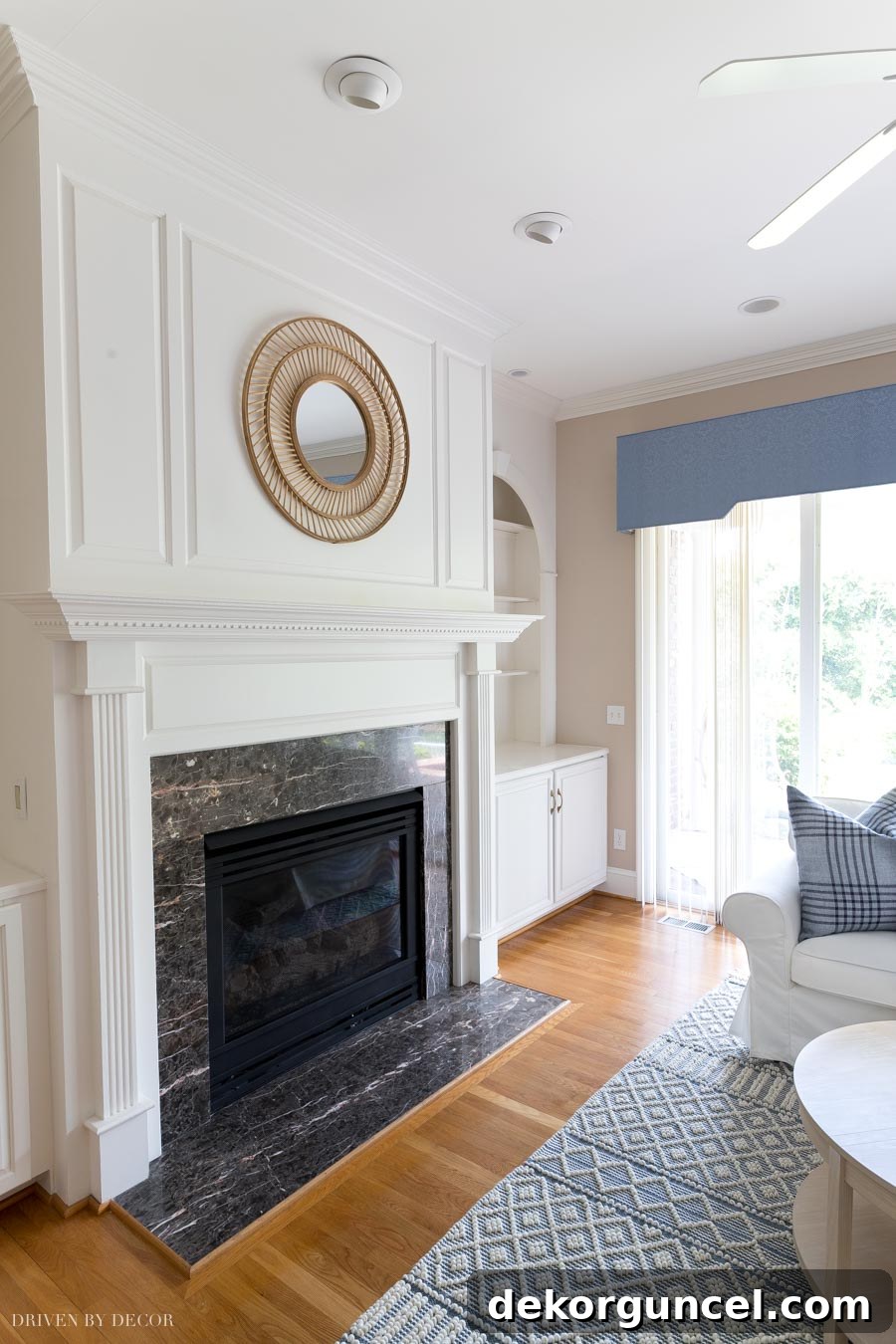 Spray Paint Your Brass Fireplace for an Instant Update 13 Our newly painted fireplace, showcasing a modern black finish instead of brass.