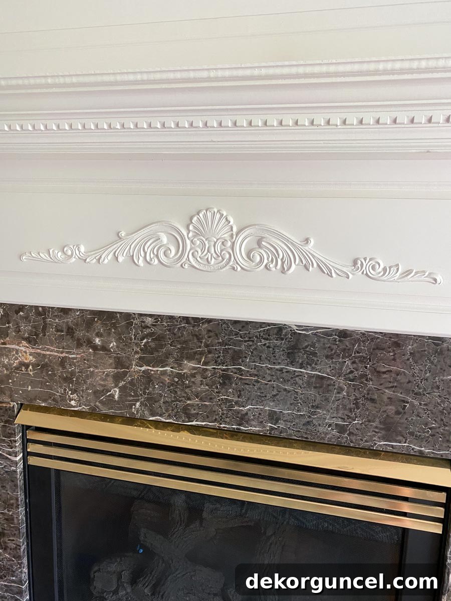 Spray Paint Your Brass Fireplace for an Instant Update 4 Close-up of the dated wooden appliques on our fireplace, ready for removal.