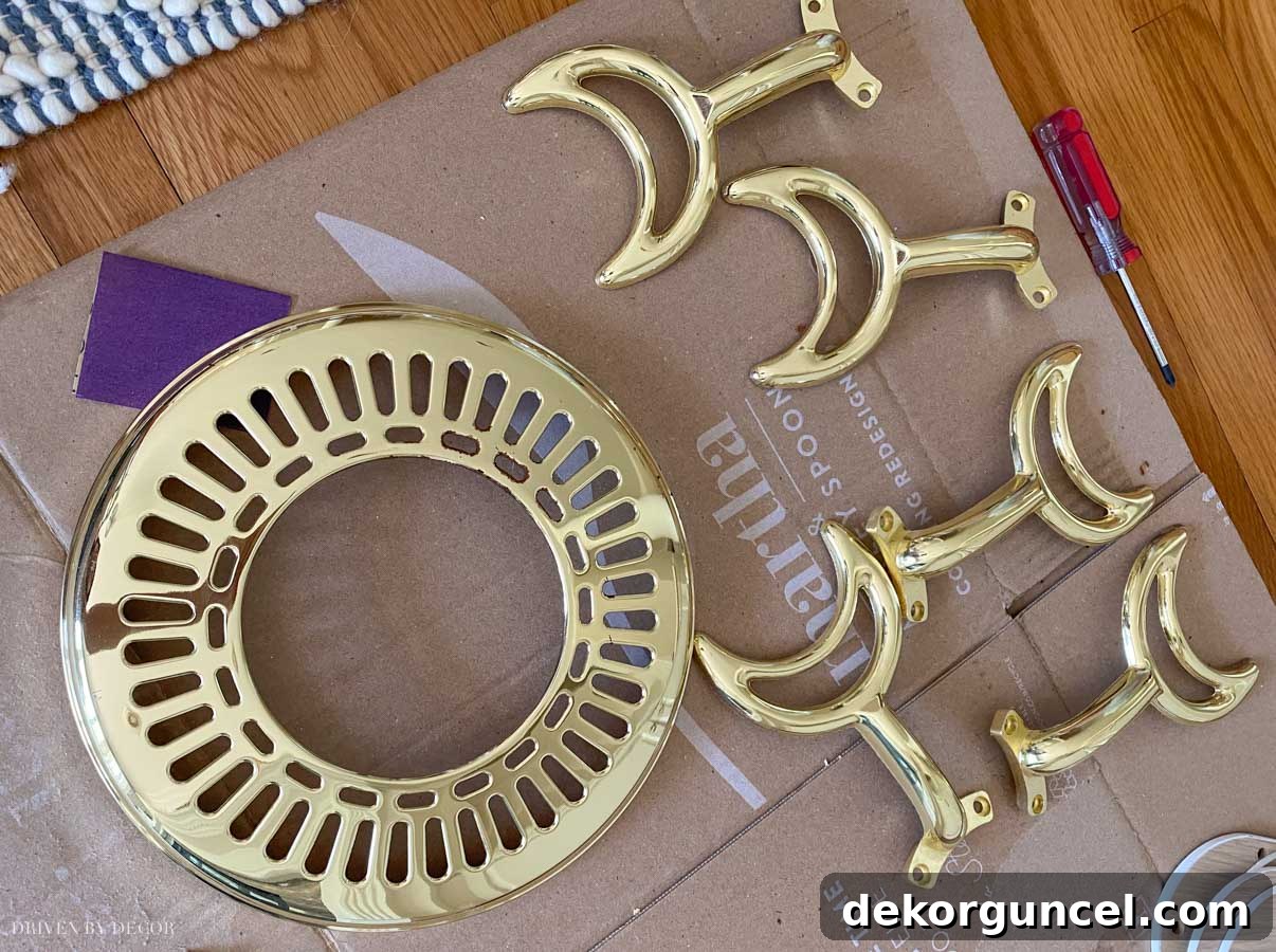 The brass ceiling fan parts disassembled and ready for spray paint – illustrating the scope of the project.