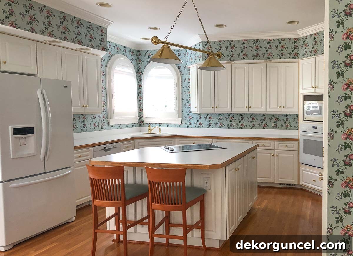 Dated kitchen before remodeling with traditional wooden cabinets and laminate countertops