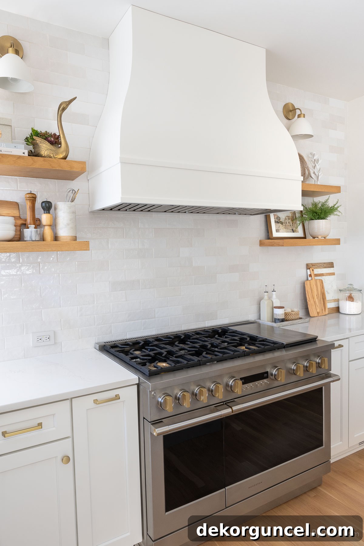 Elegant floating wood shelves on the kitchen range wall, thoughtfully styled with decorative and functional items