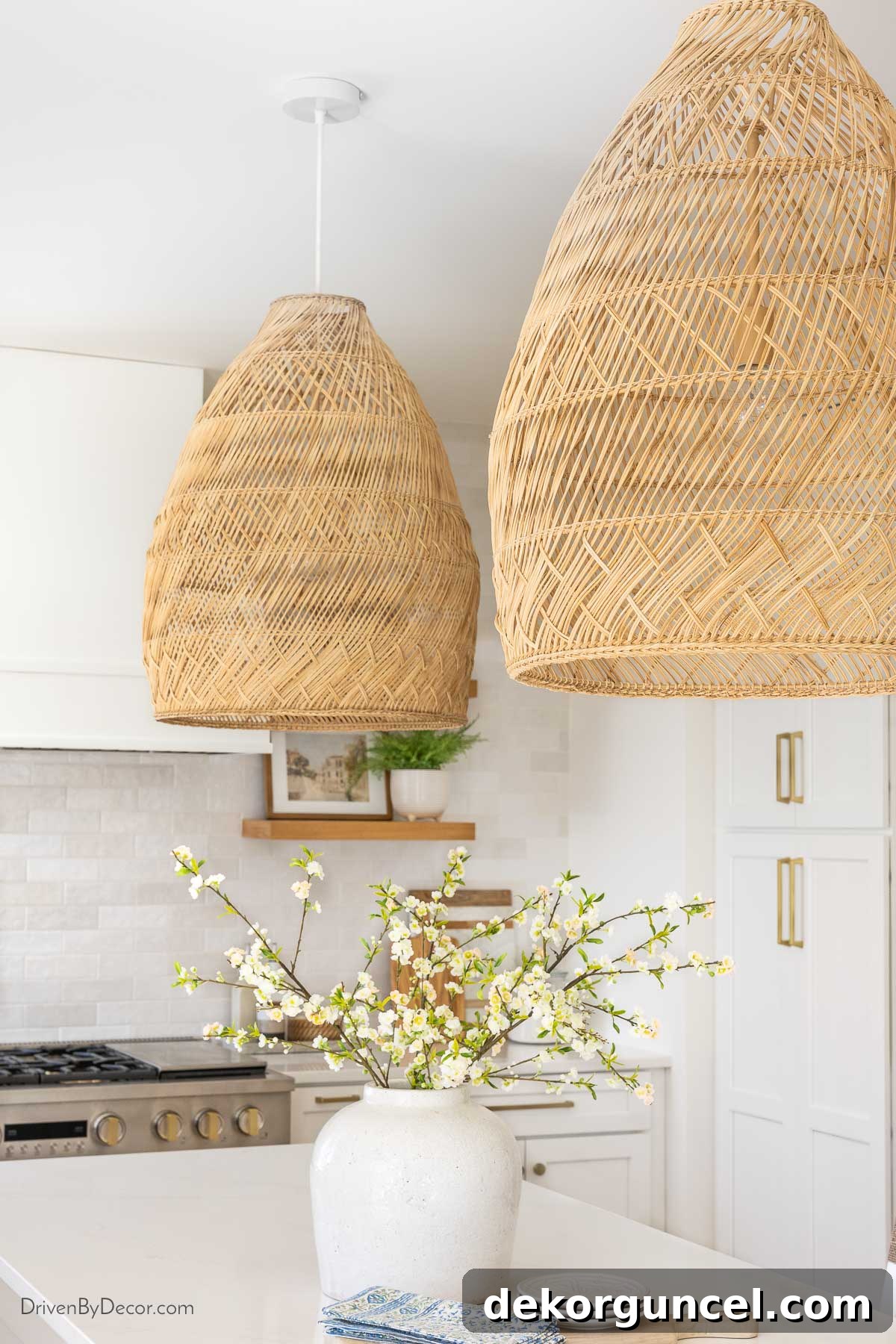 Two large rattan bell pendants hanging elegantly over our kitchen island