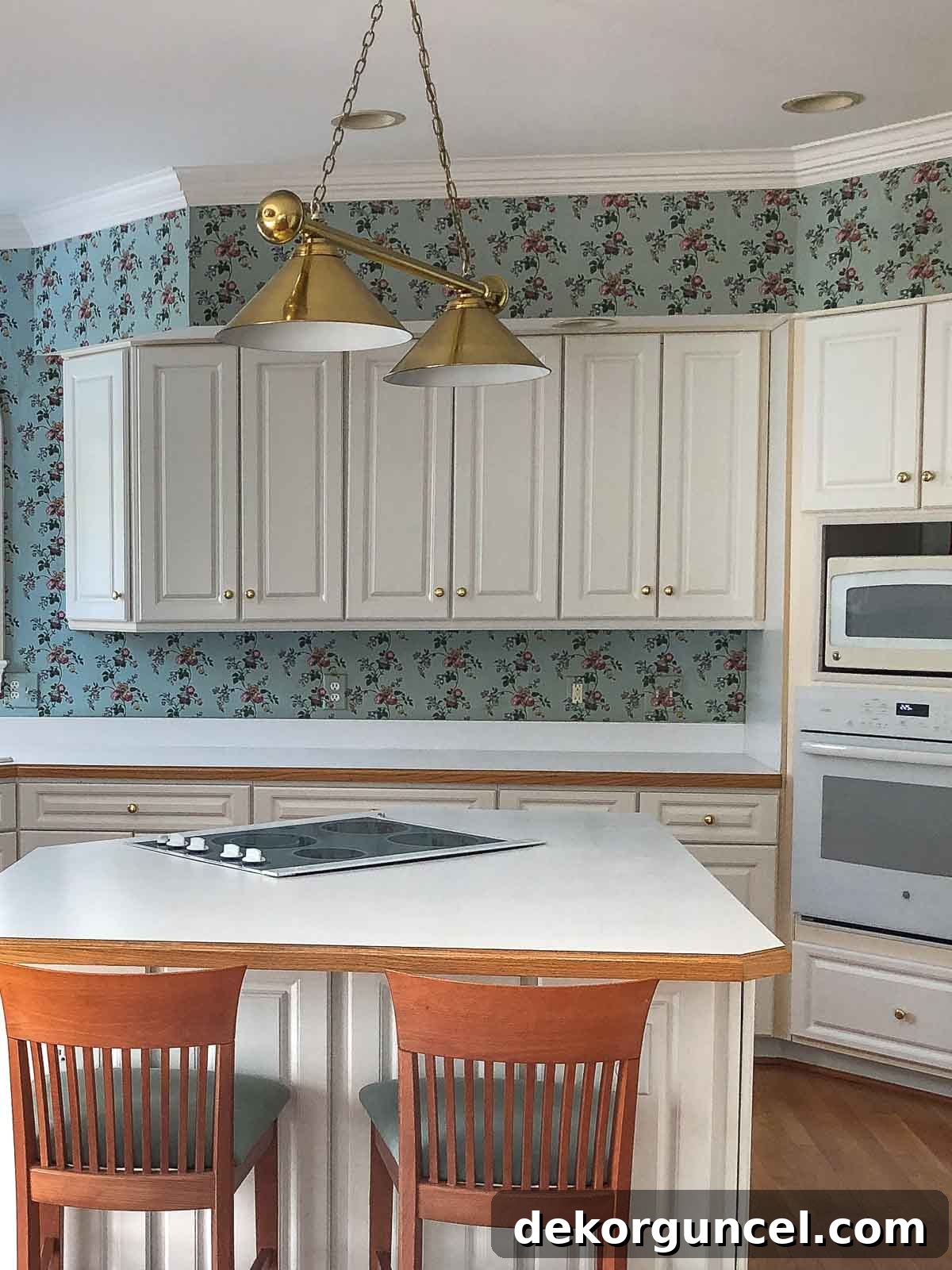 Dated kitchen with old floral wallpaper and traditional layout