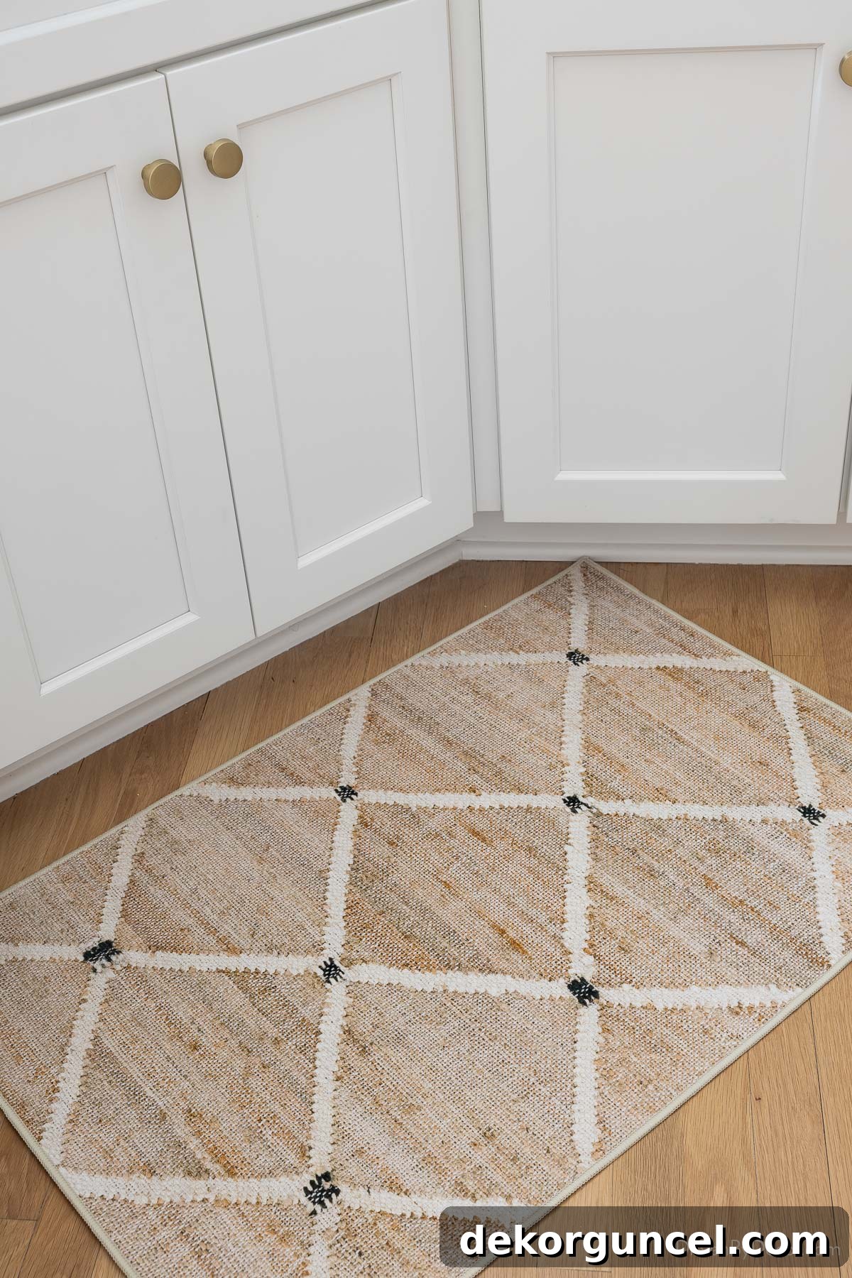 Washable kitchen rug in front of the sink, blending practicality with a stylish pattern