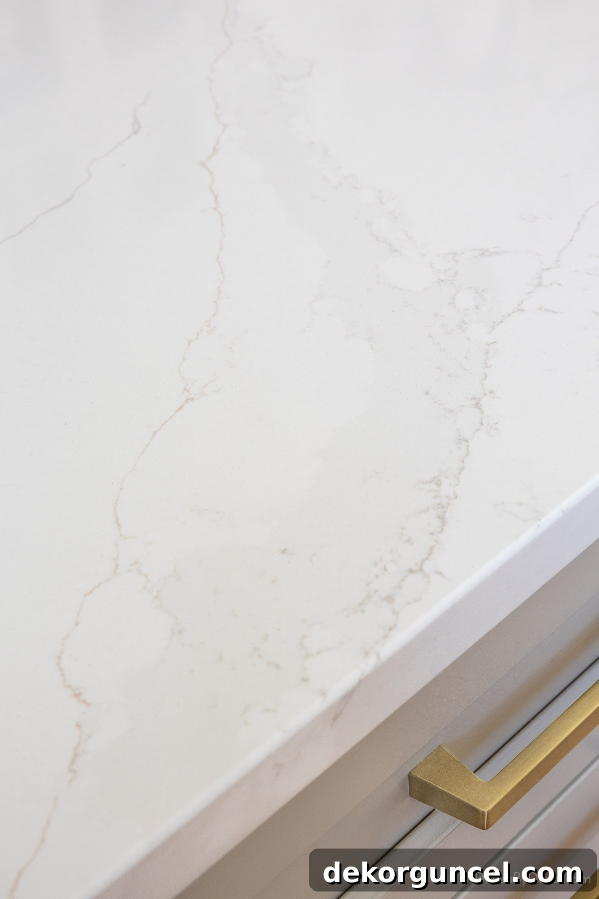 White quartz countertops with elegant gray and beige veining, offering a luxurious yet durable surface