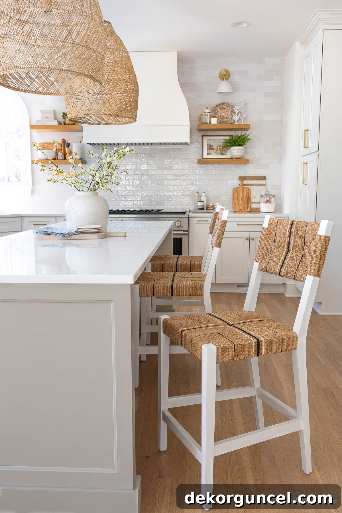 Stylish woven kitchen counter stools positioned around our island, creating an inviting seating area