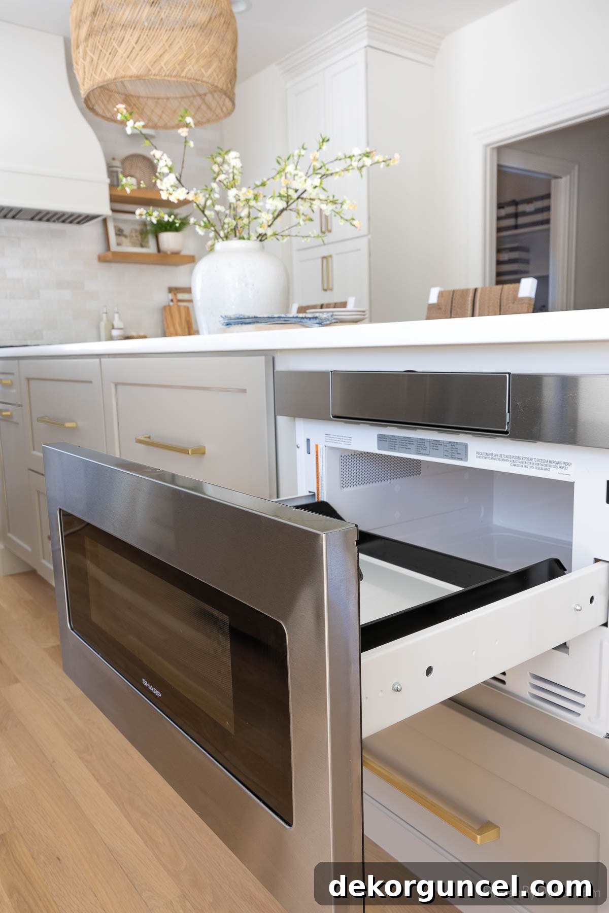 Sleek microwave drawer seamlessly integrated into the kitchen island, maximizing counter space