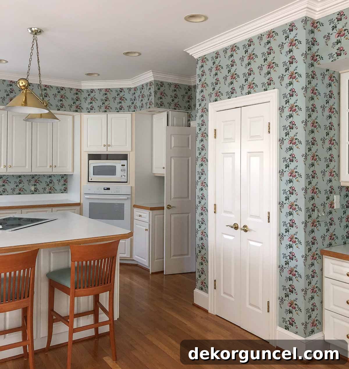 Another view of the dated kitchen before renovation, highlighting old finishes