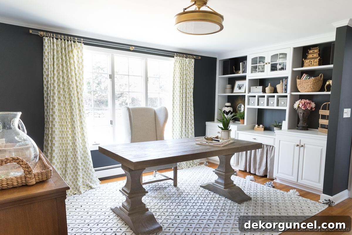 Acrylic curtain rods with patterned curtains against black walls in home office