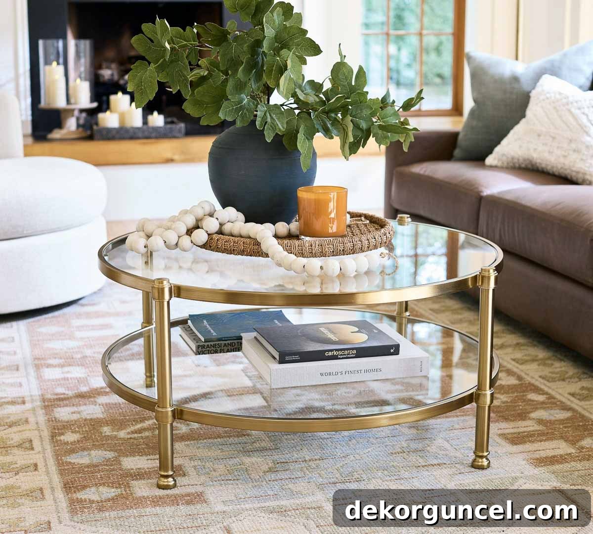 Round woven tray with plant, beads, and candle on round glass coffee table