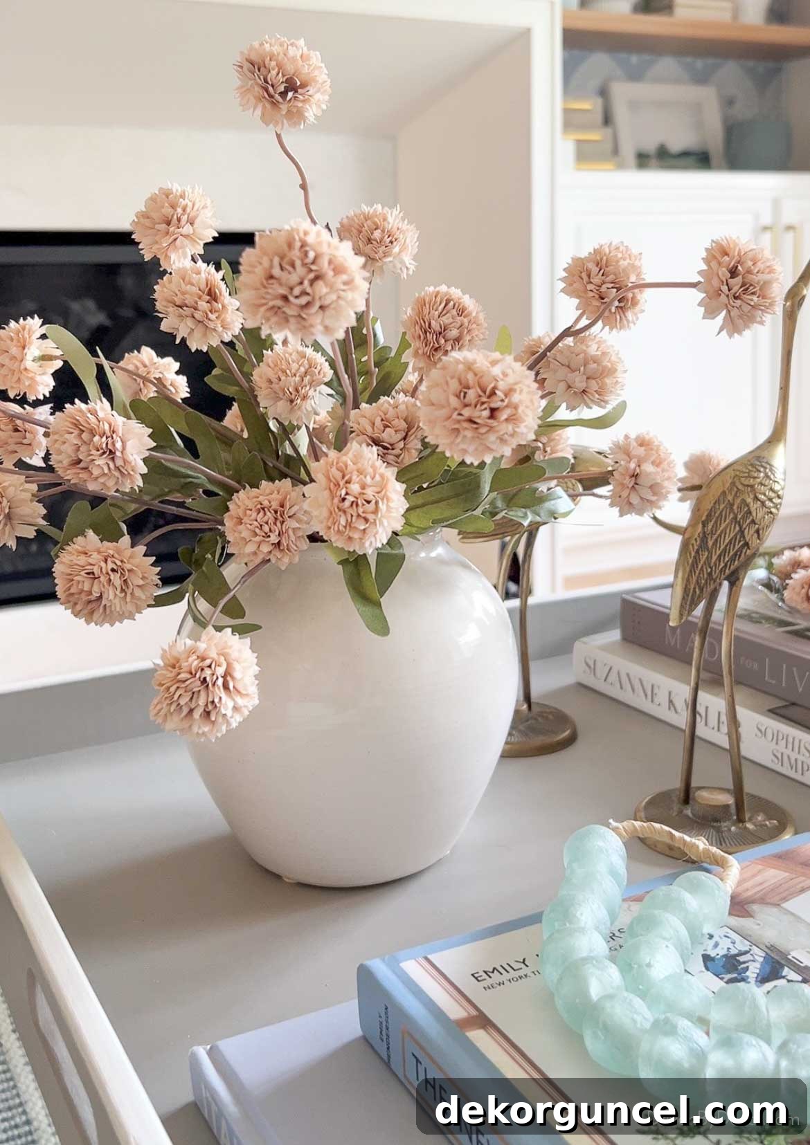 Fall flowers in white vase on round coffee table