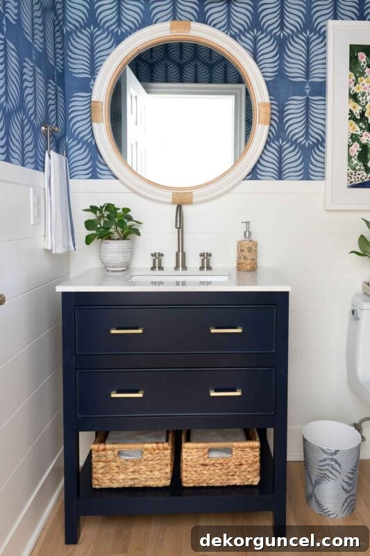 Navy vanity in powder room with combined drawer and shelf storage