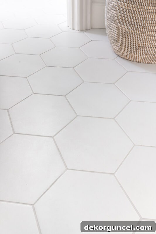 Large white hexagon tile on bathroom floor for a modern yet timeless look