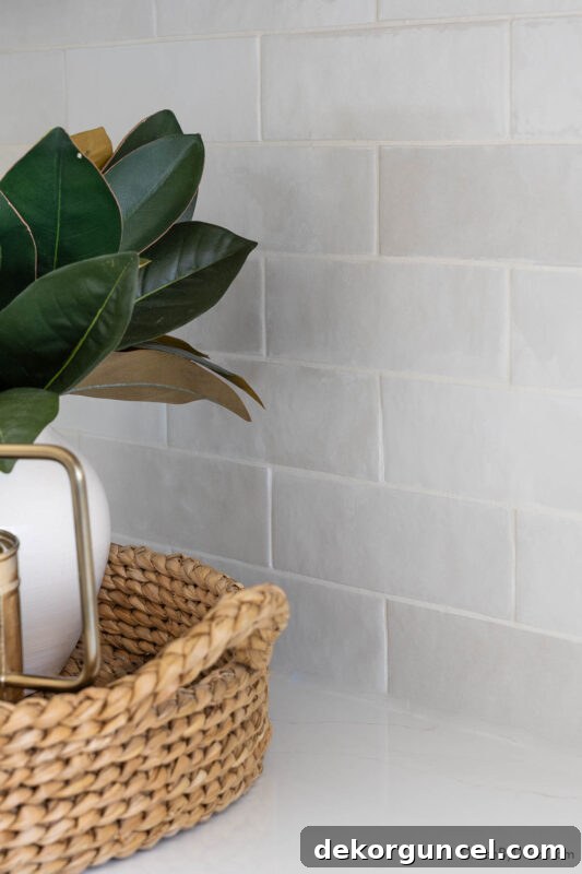 Subway tile backsplash in varied shades of white and gray