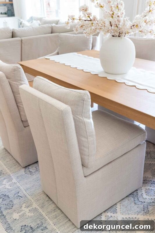 Upholstered dining room chairs on casters, perfect for easy movement