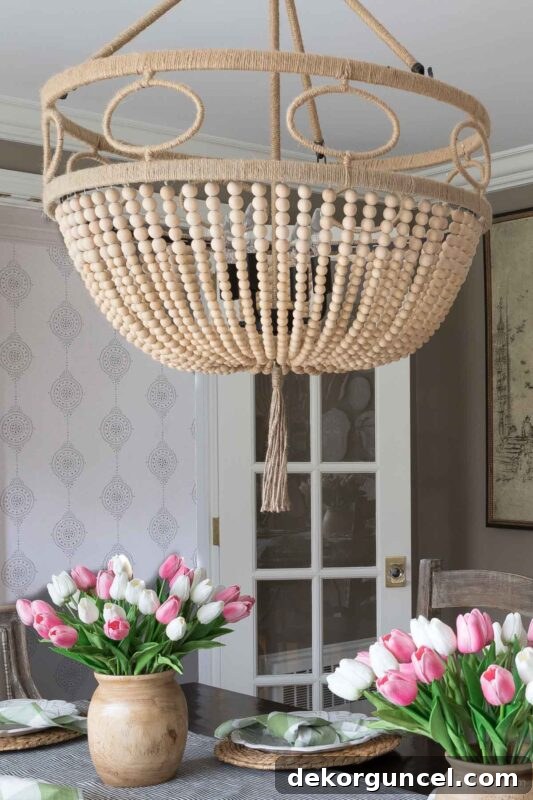 Wood bead chandelier for dining room with neutral aesthetic