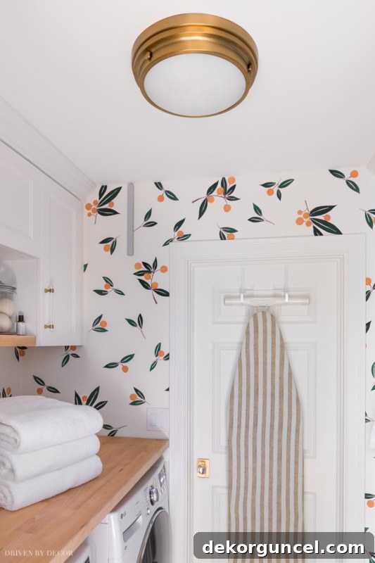 Simple yet stylish flush mount ceiling light in laundry room