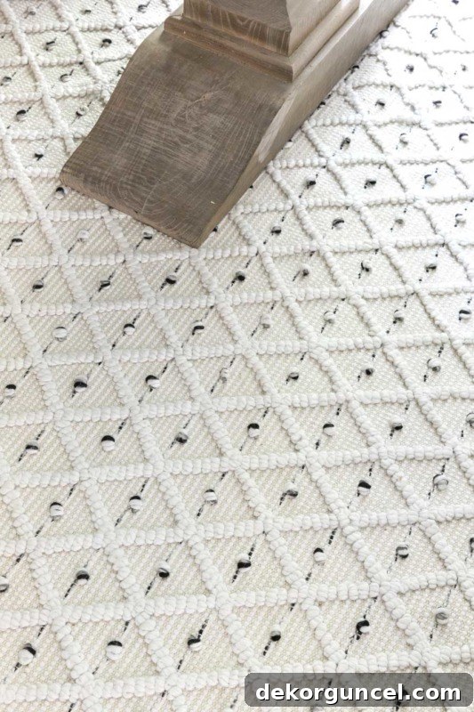 Patterned flatweave rug in cream with gray and black, used in home office