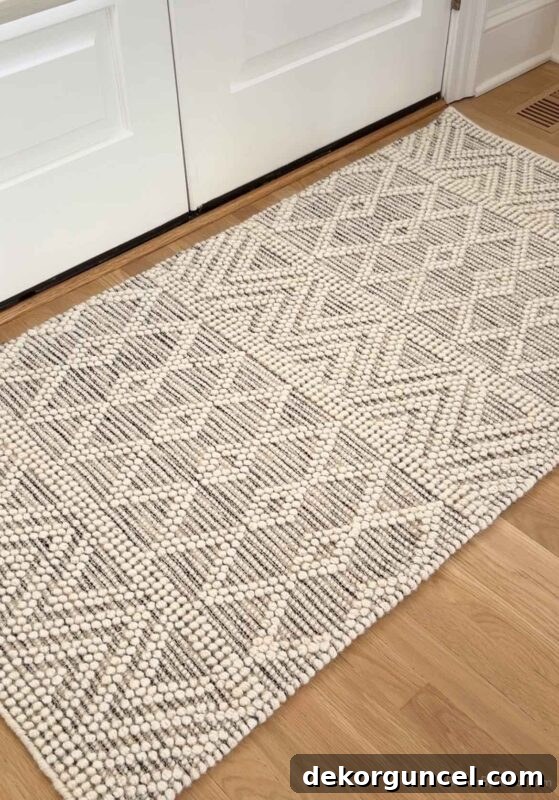 Textured neutral rug in entryway, highly reviewed