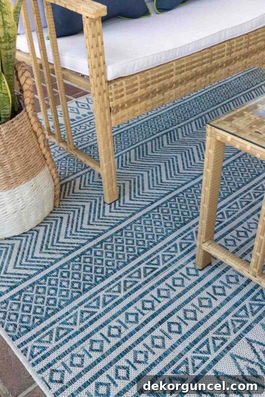 Blue and white geometric outdoor rug