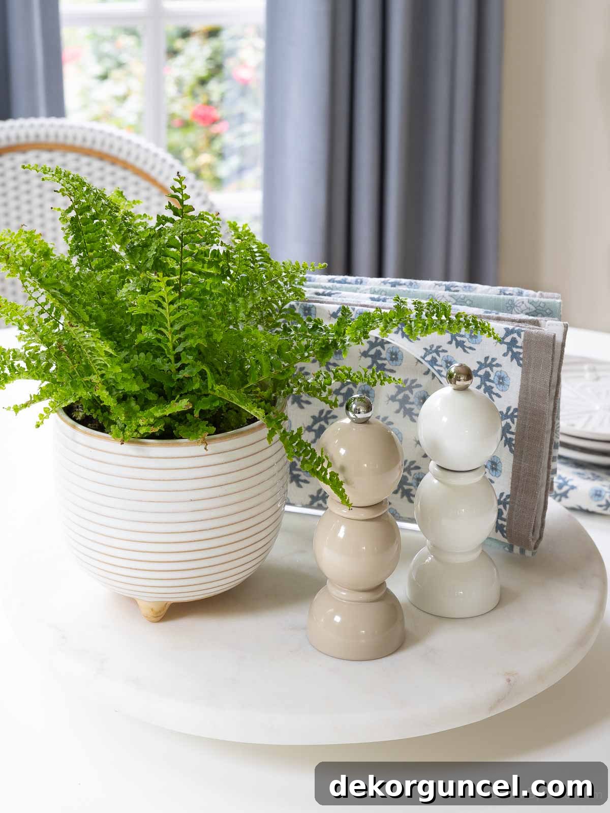 Our Breakfast Nook Makeover: Before and After Photos and a Bay Window Curtain Tutorial 8 Lazy Susan with planter, salt and pepper shakers, and napkins