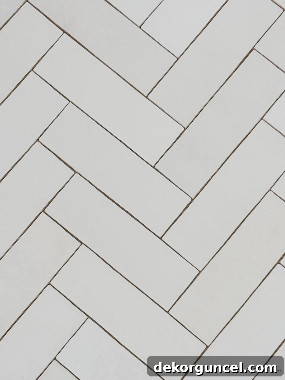 Subway tile laid in an elegant herringbone pattern, adding dynamic movement and sophistication to a space.