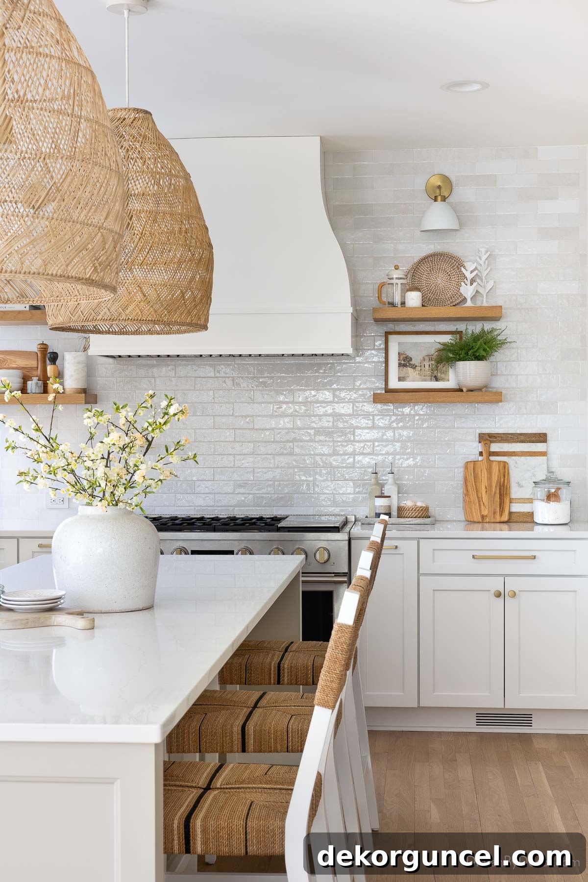 Remodeled kitchen with a subway tile backsplash in running bond pattern, featuring a new range hood and floating shelves.