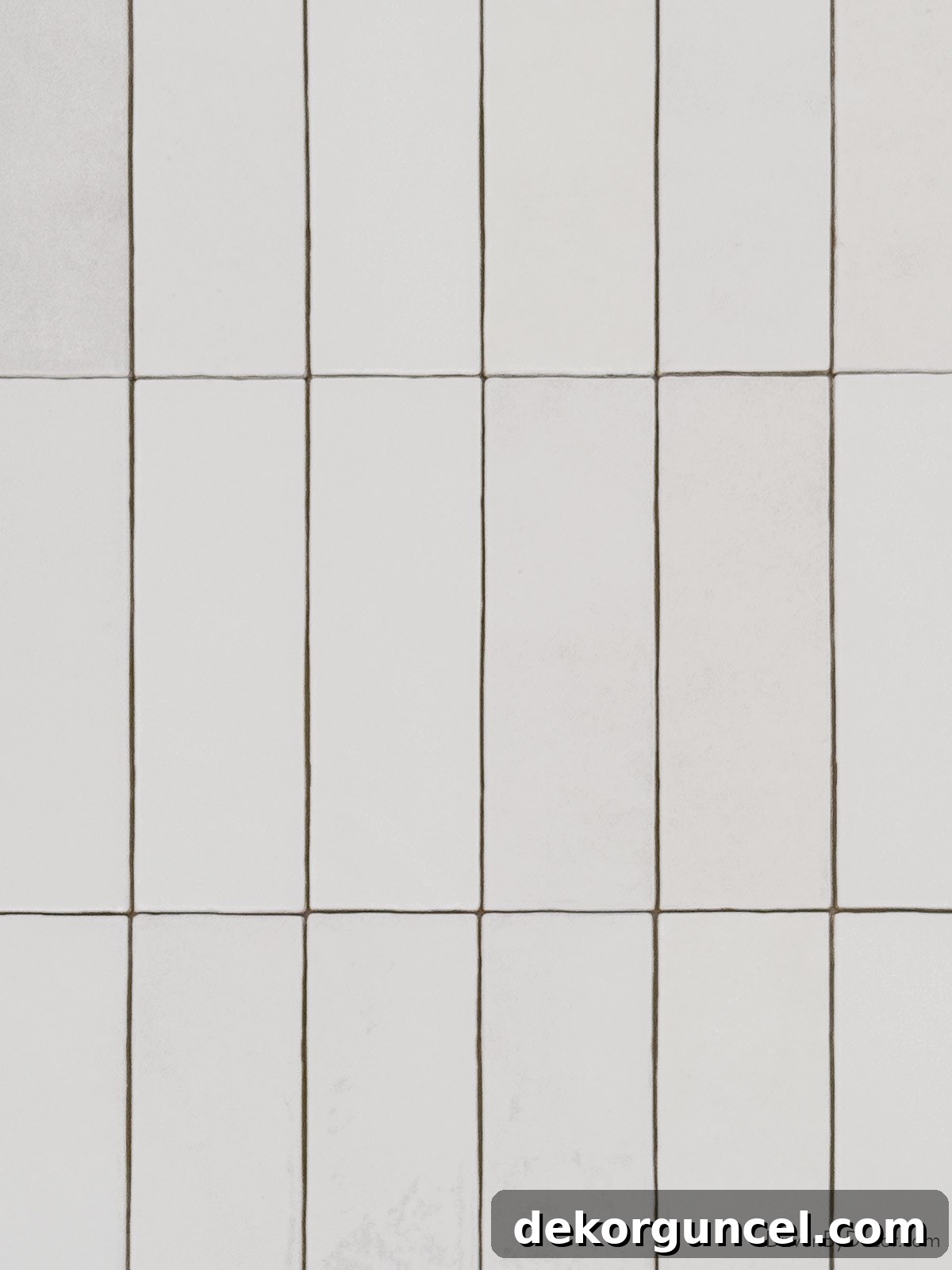 Subway tile laid in a modern vertical stack pattern, emphasizing height in the room.