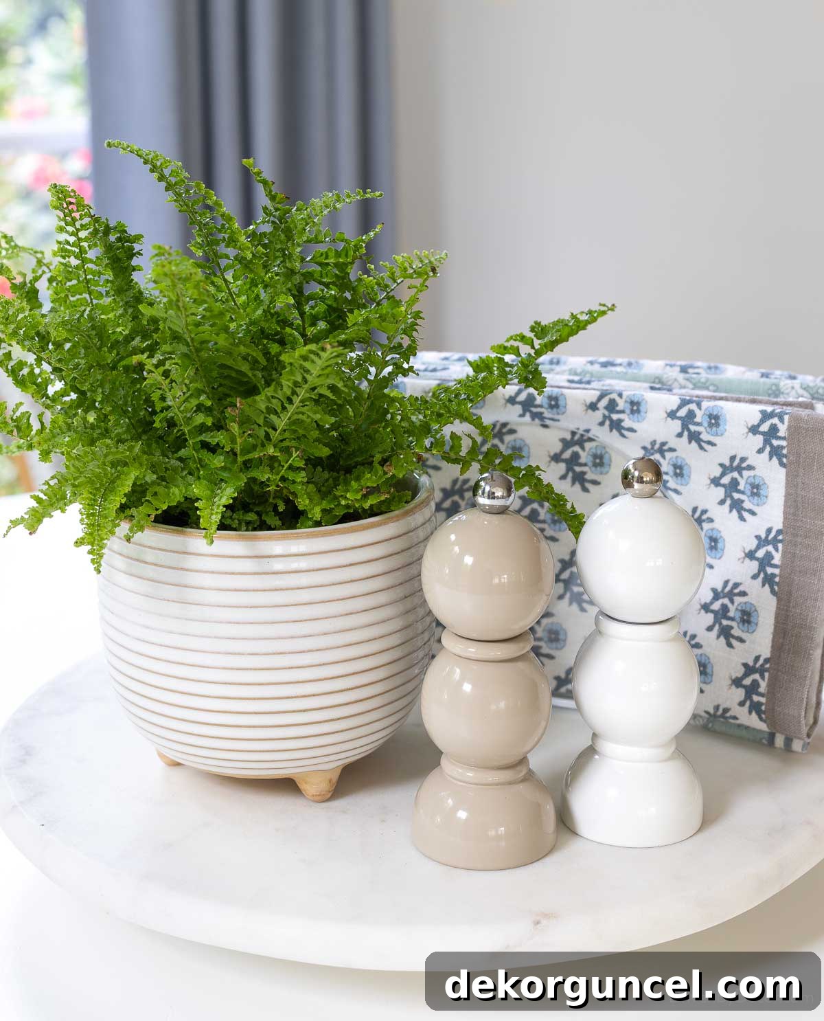 Spindle salt and pepper shakers with plant on lazy Susan