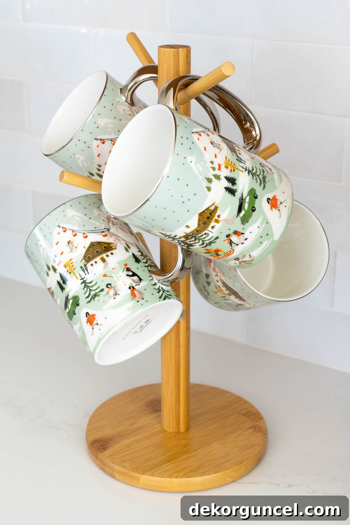 Christmas themed mugs displayed on a mug holder tree on a coffee bar