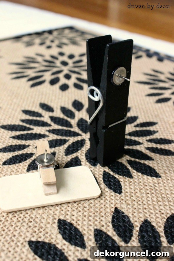 Handcrafted Burlap Pinboard 9 DIY idea: Hot gluing a thumbtack onto a chalkboard clothespin to create a functional bulletin board clip
