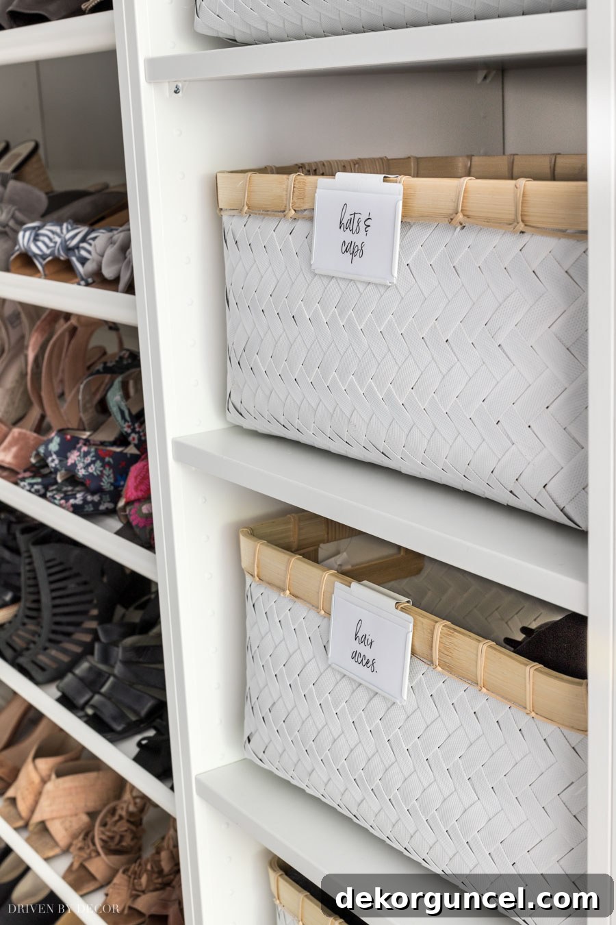 A floor-to-ceiling display of neatly arranged storage baskets on IKEA KOMPLEMENT shelves within a PAX closet, showcasing efficient vertical organization.