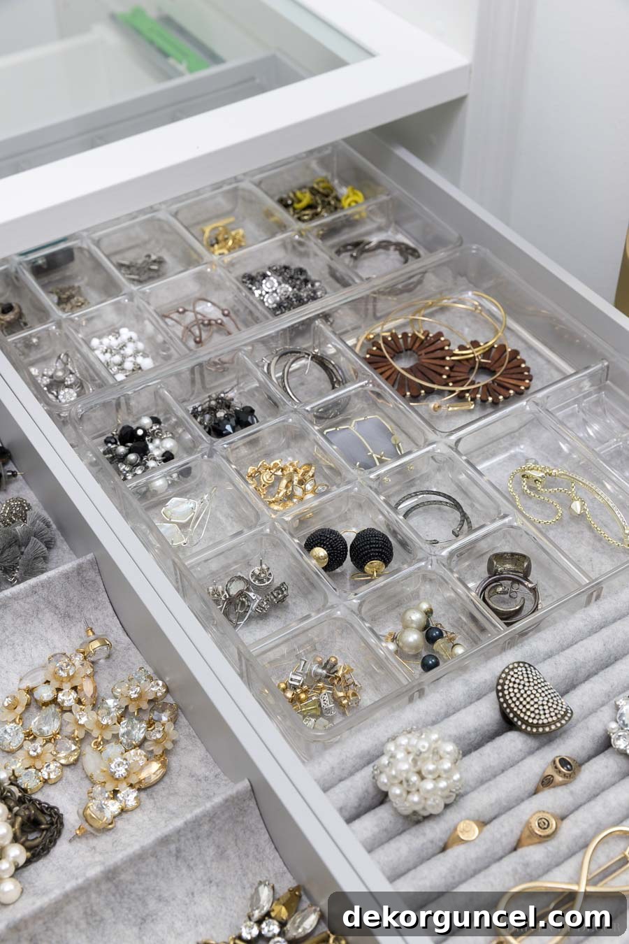 Customized IKEA PAX drawer with integrated small plastic organizers, specifically adapted for efficient earring and delicate jewelry storage.