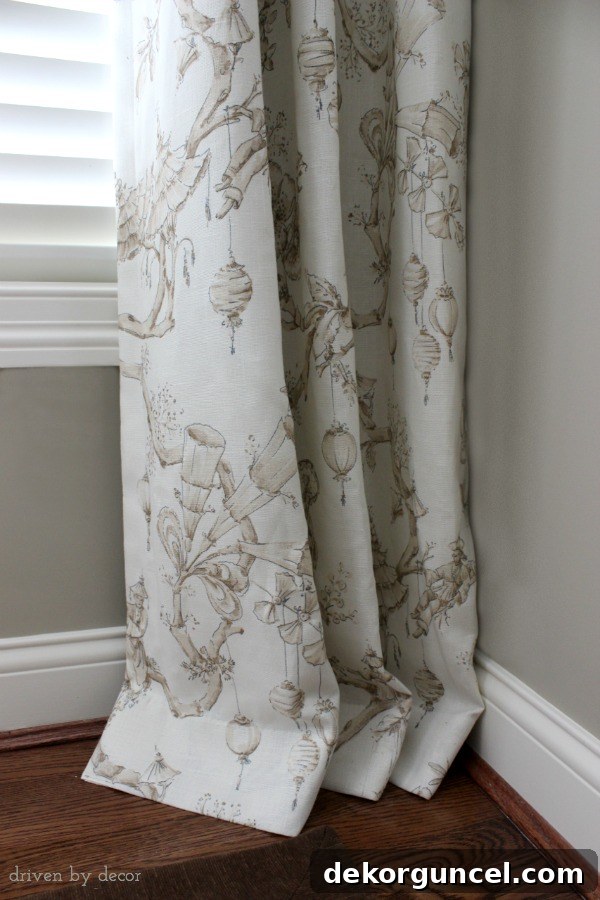 Dining room drapes featuring a sophisticated 2-inch break at the floor, enhancing the formal elegance of the space.