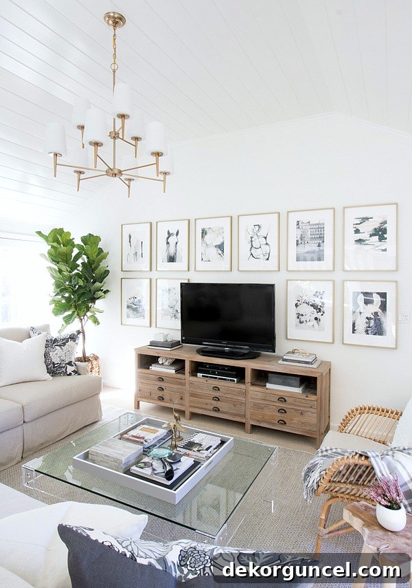 The Most Realistic Faux Fiddle Leaf Fig Trees 2 Family room with fabulous art wall around the TV and a thriving fiddle leaf fig