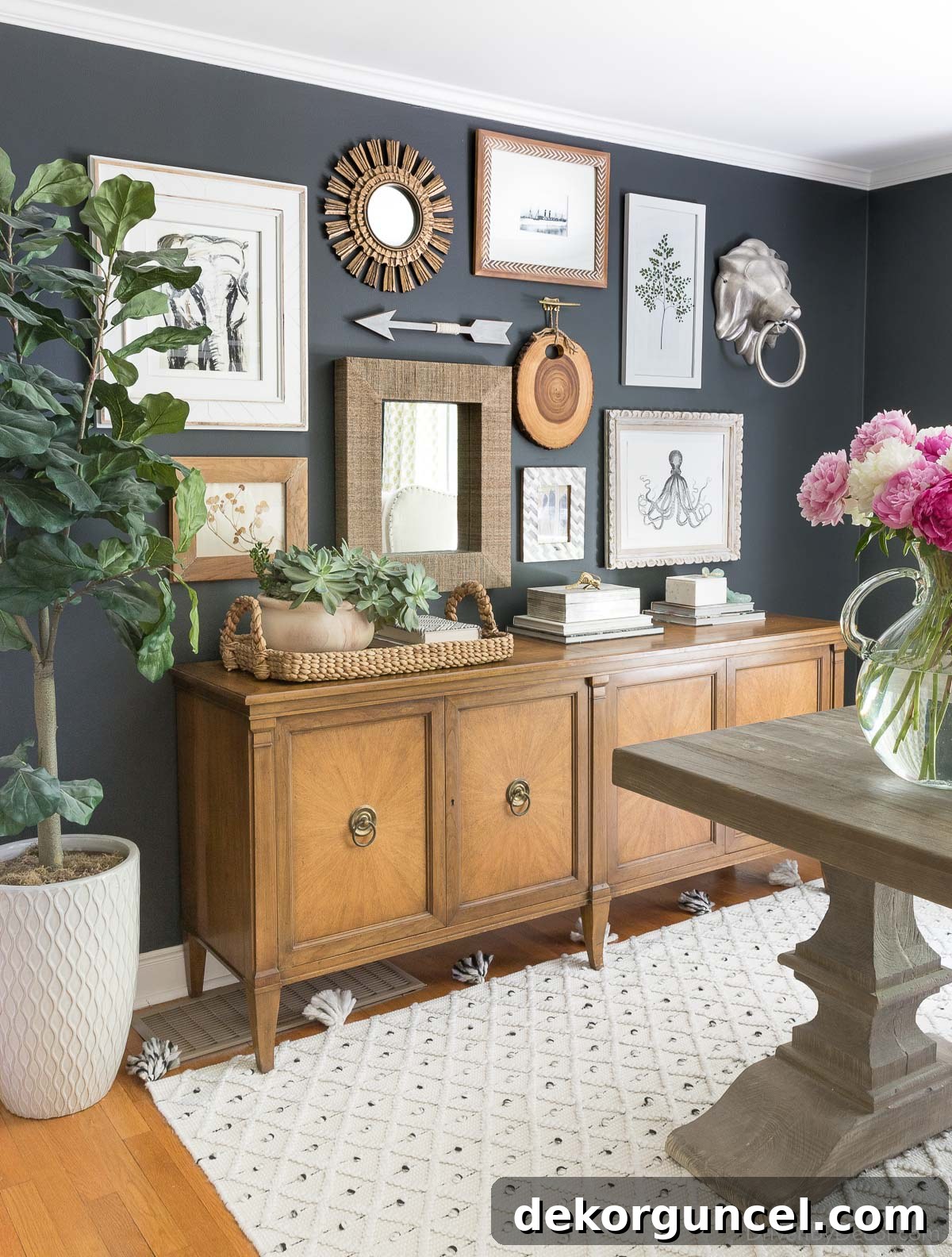 An inspiring gallery wall featuring diverse art pieces on sophisticated black home office walls, demonstrating balanced art placement.