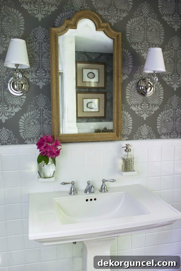 Powder room with stenciled walls and bud vase on built-in toothbrush holder!