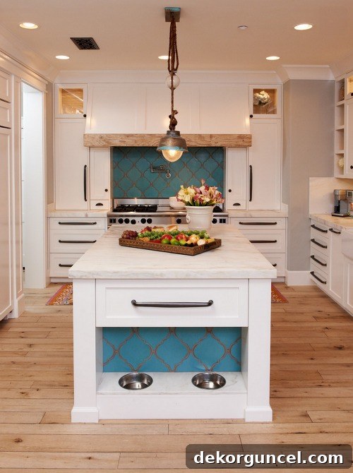 Built-in dog bowls integrated into modern kitchen cabinetry, designed by Intimate Living Interiors, providing a clean and elegant feeding solution.