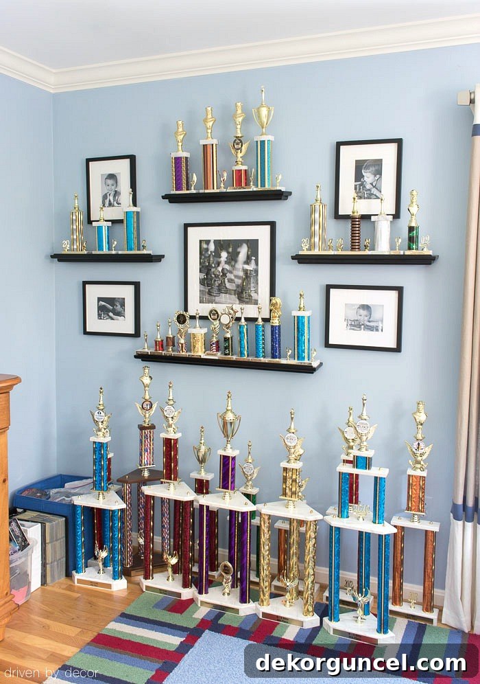 An inspiring gallery wall concept for displaying children's trophies and awards alongside cherished photos.
