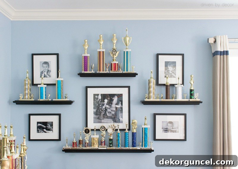 A wonderful method for displaying kids' trophies, beautifully integrated with photos of them pursuing their passions.