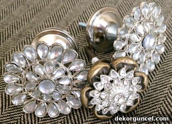 Rhinestone and gold cabinet knobs beautifully repurposed as medal holders for an awards display.